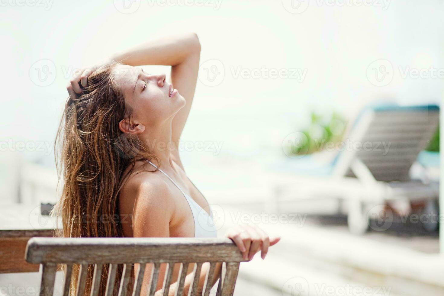 Beautiful woman by the pool photo