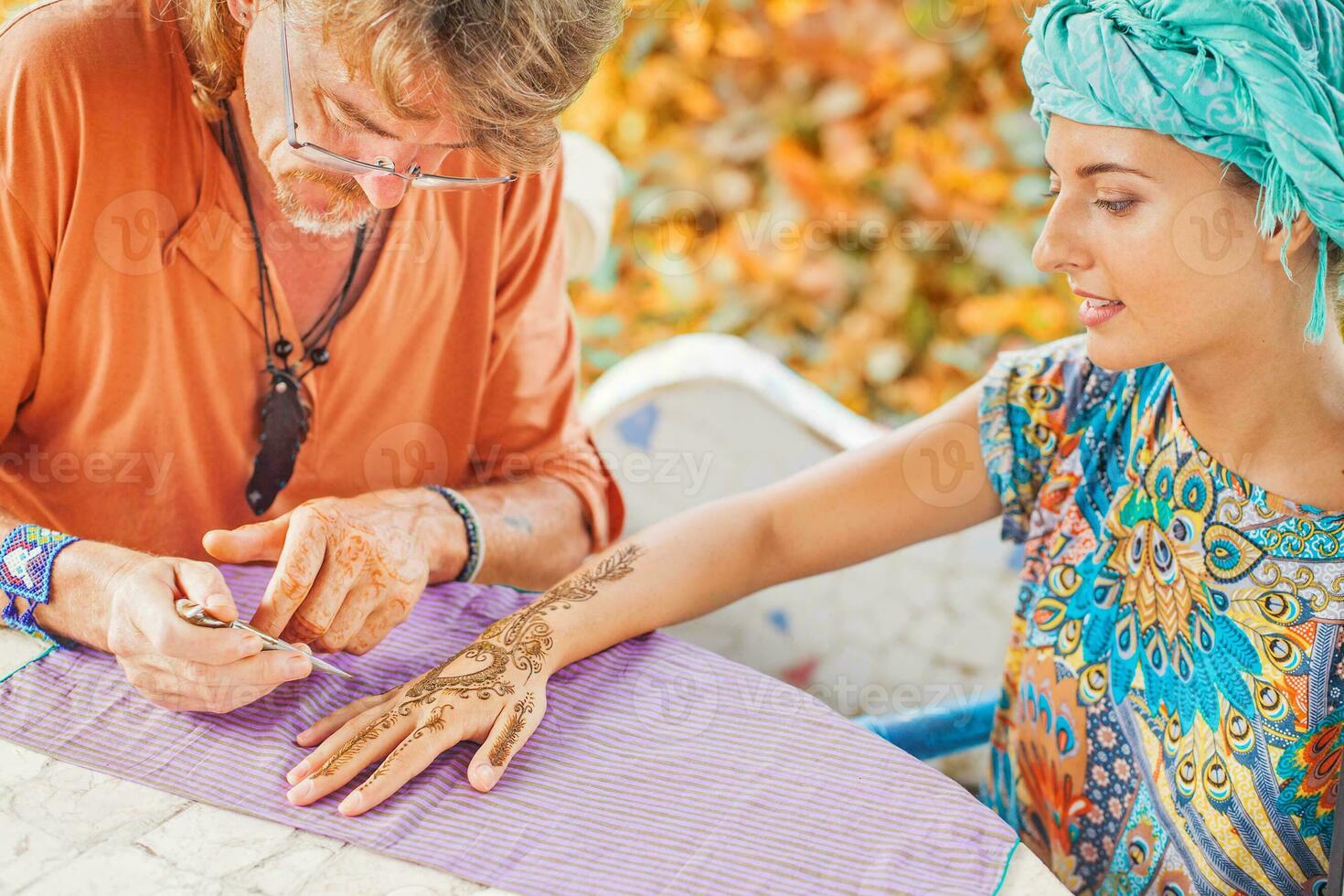 Woman with henna tattoo on her hand photo