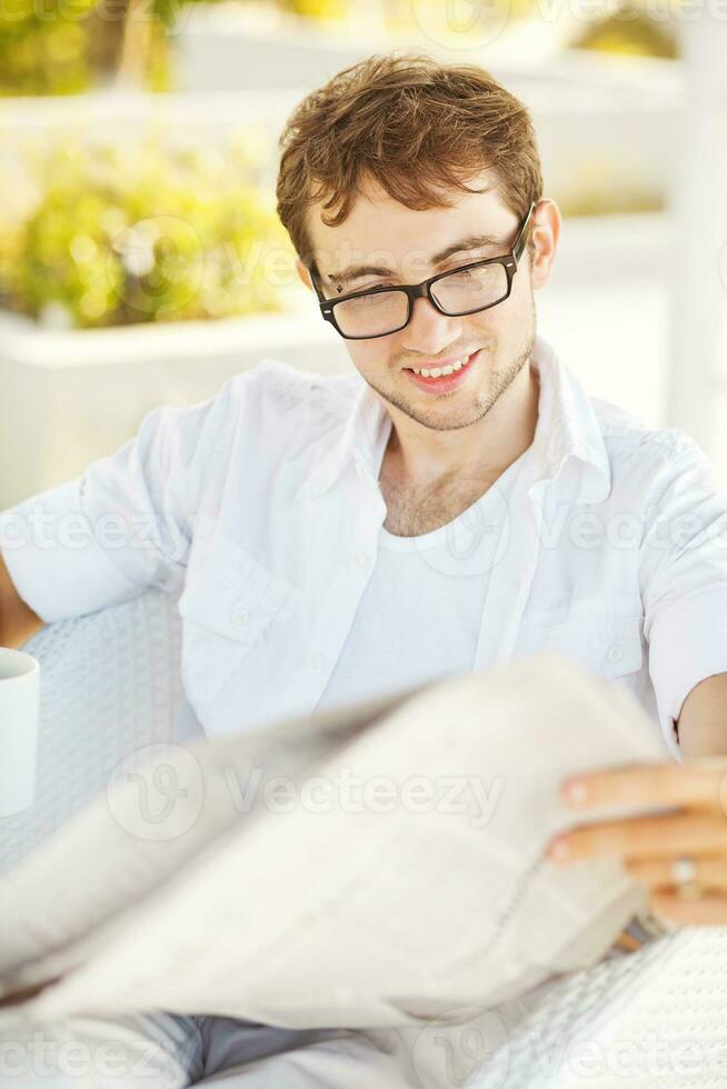 Man reading newspaper photo