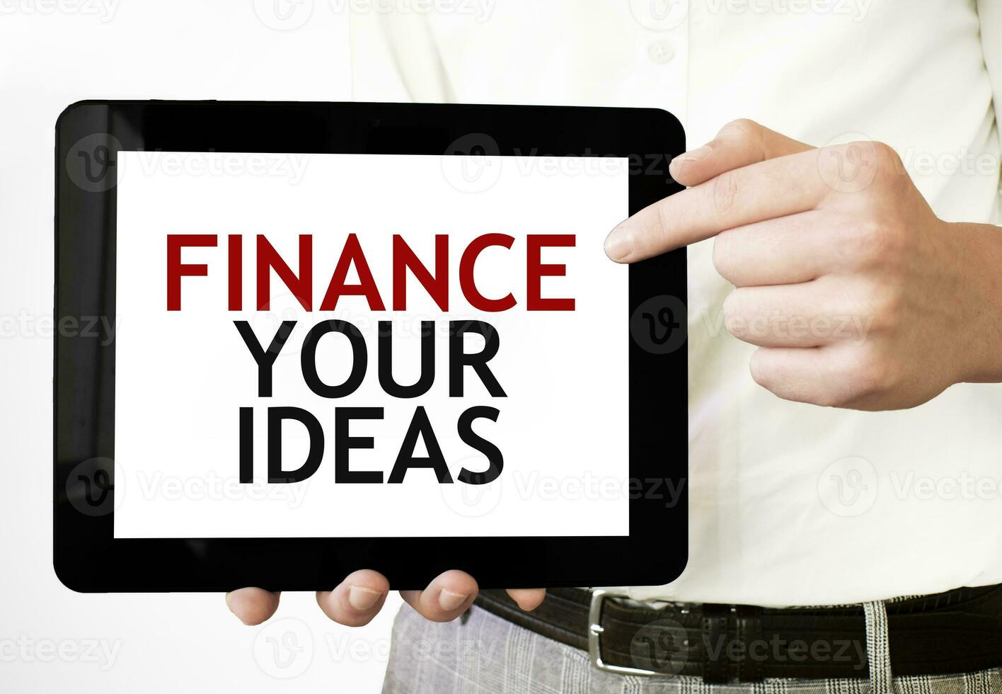 Text FINANCE YOUR IDEAS on tablet display in businessman hands on the white background. Business concept photo