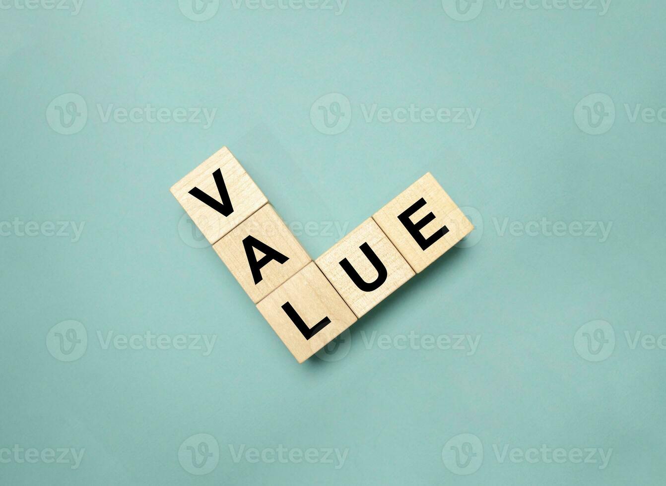 VALUE symbol. Concept word Basics on wooden blocks. photo