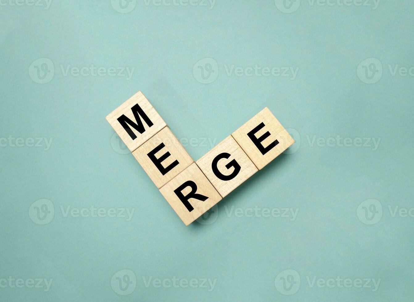 MERGE symbol. Concept word Basics on wooden blocks. photo