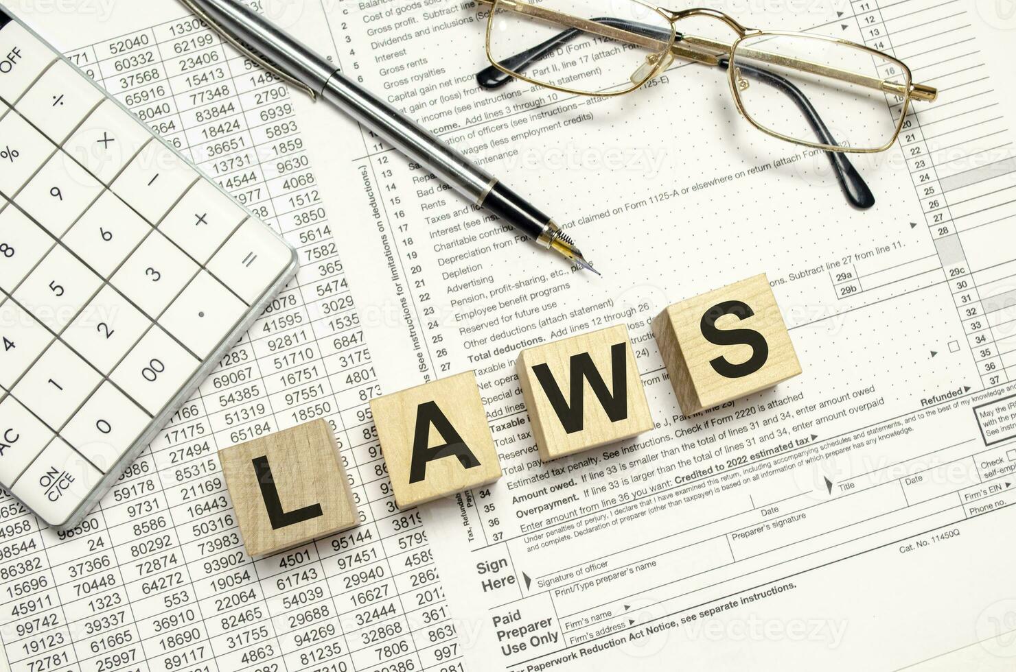 laws. Word Written In Wooden Cubes on documents photo