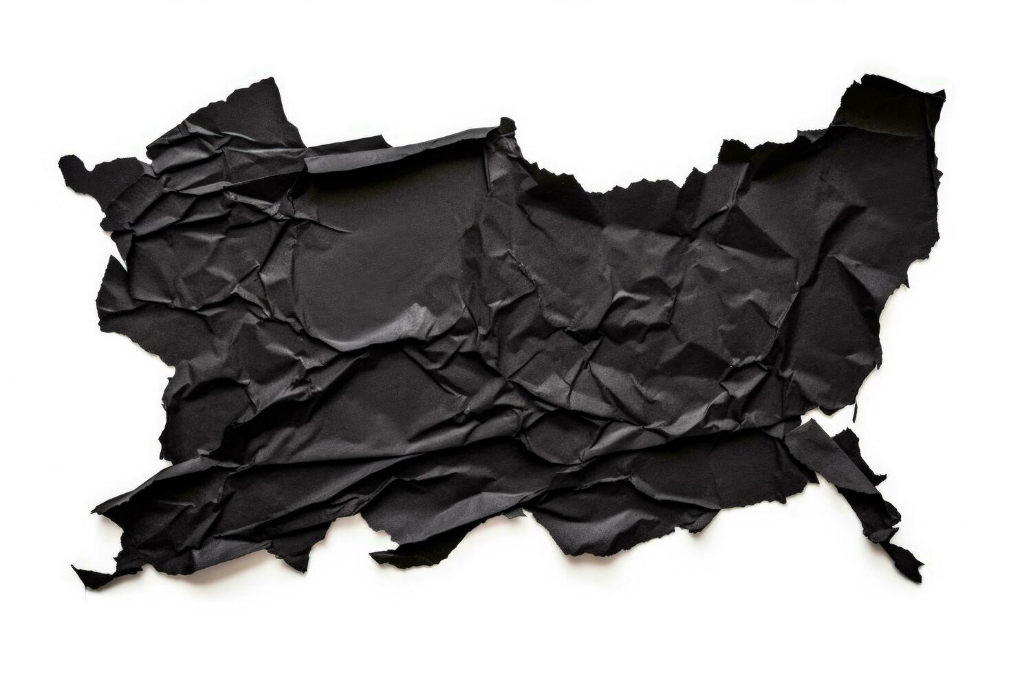Black torn paper piece isolated on white background photo