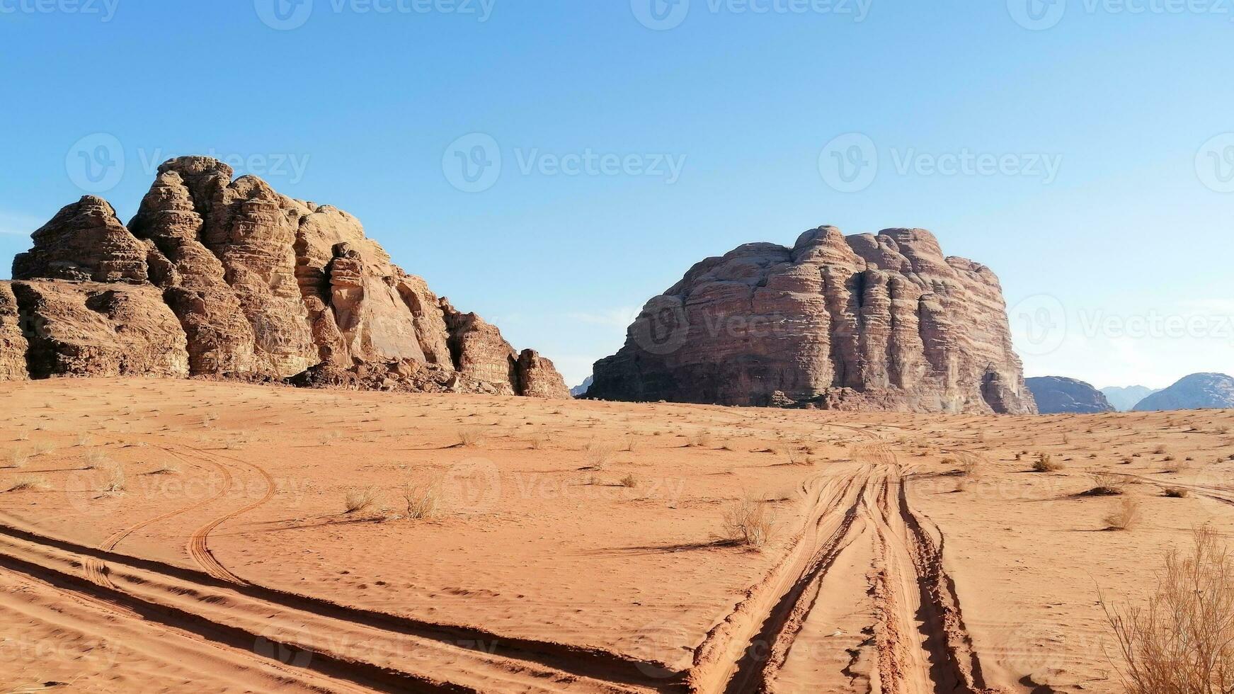 With camel caravan through the deserts of Wadi Rum, Jordan photo