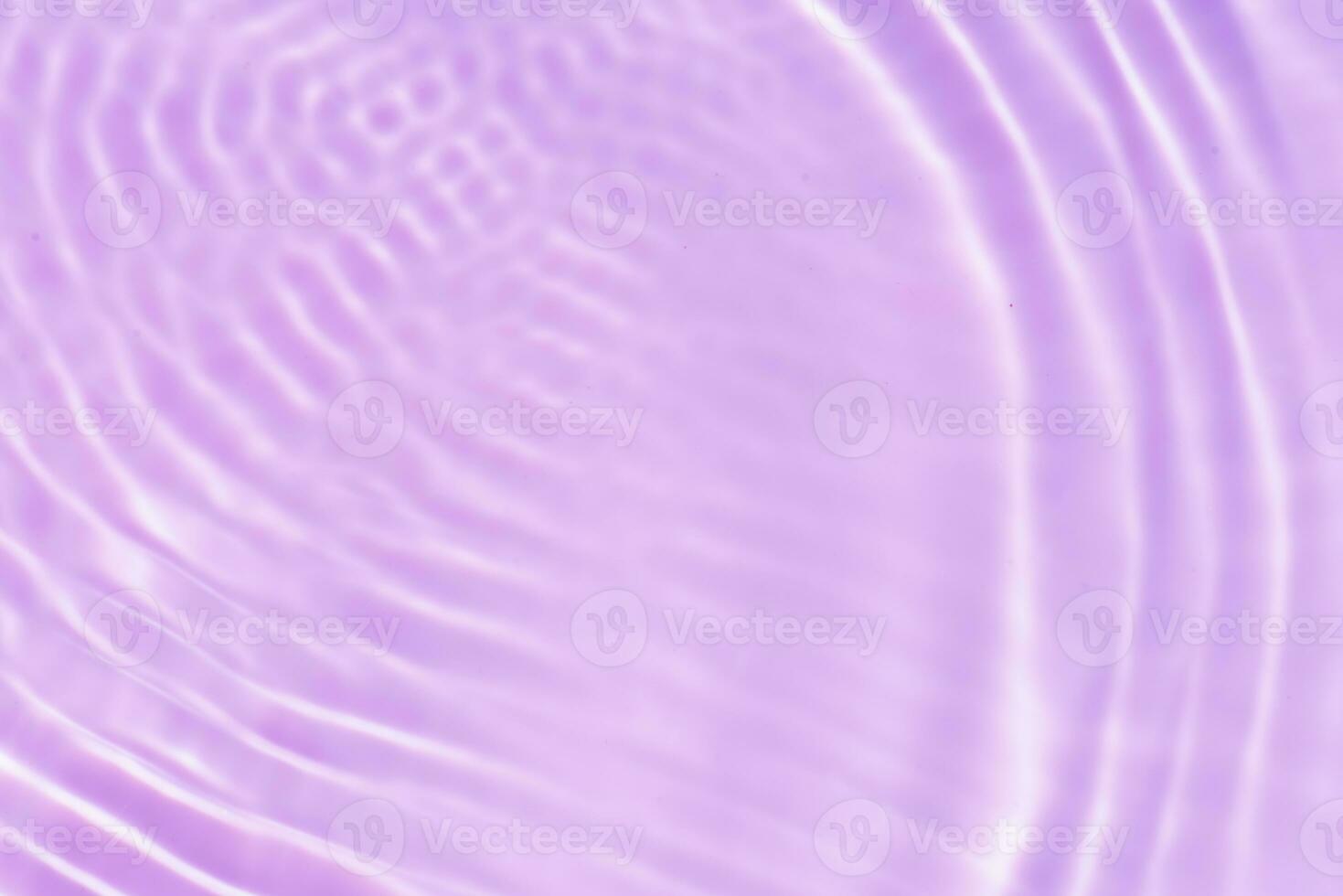 Blue water with ripples on the surface. Defocus blurred transparent blue colored clear calm water surface texture with splashes and bubbles. Water waves with shining pattern texture background. photo