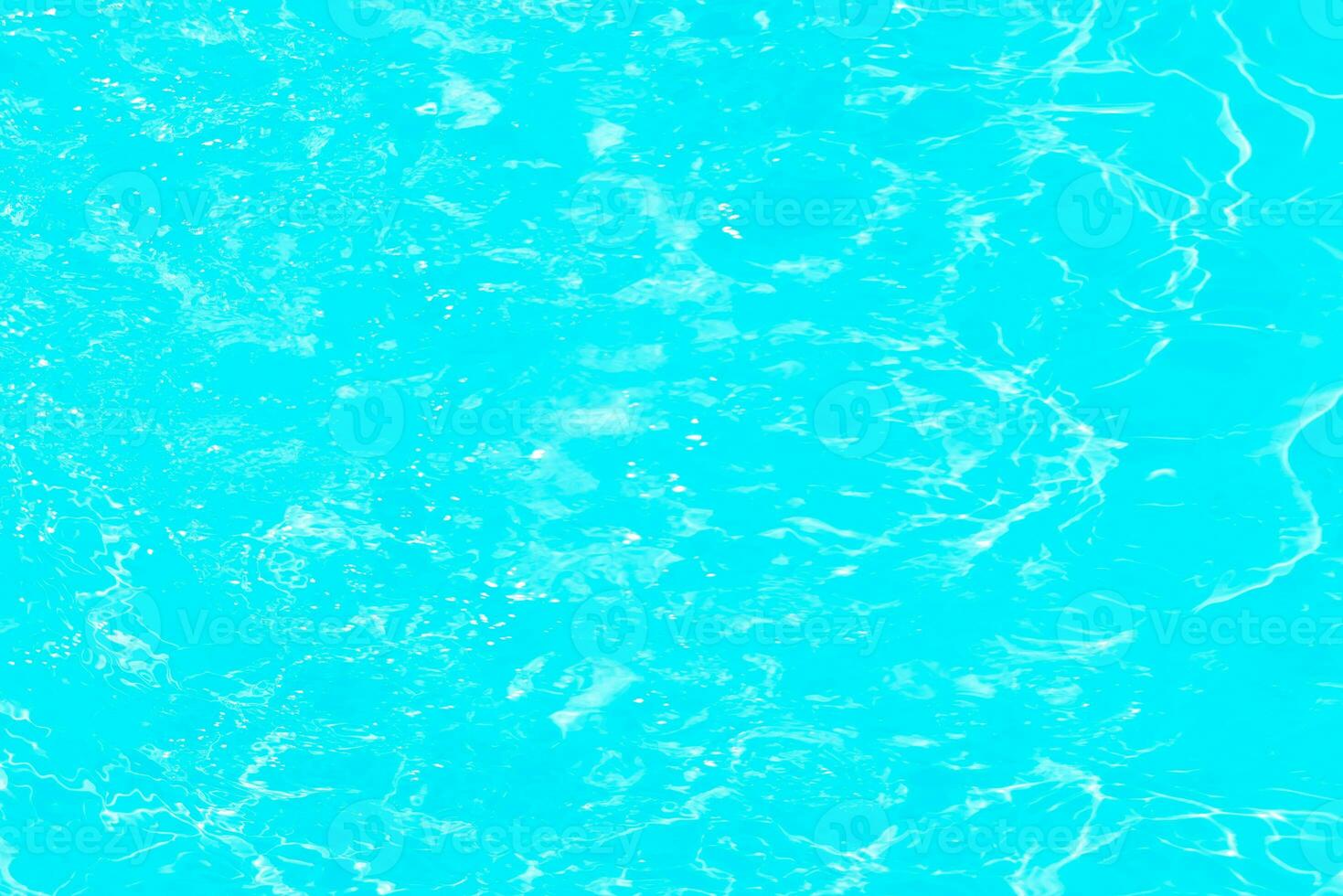 Blue water with ripples on the surface. Defocus blurred transparent blue colored clear calm water surface texture with splashes and bubbles. Water waves with shining pattern texture background. photo