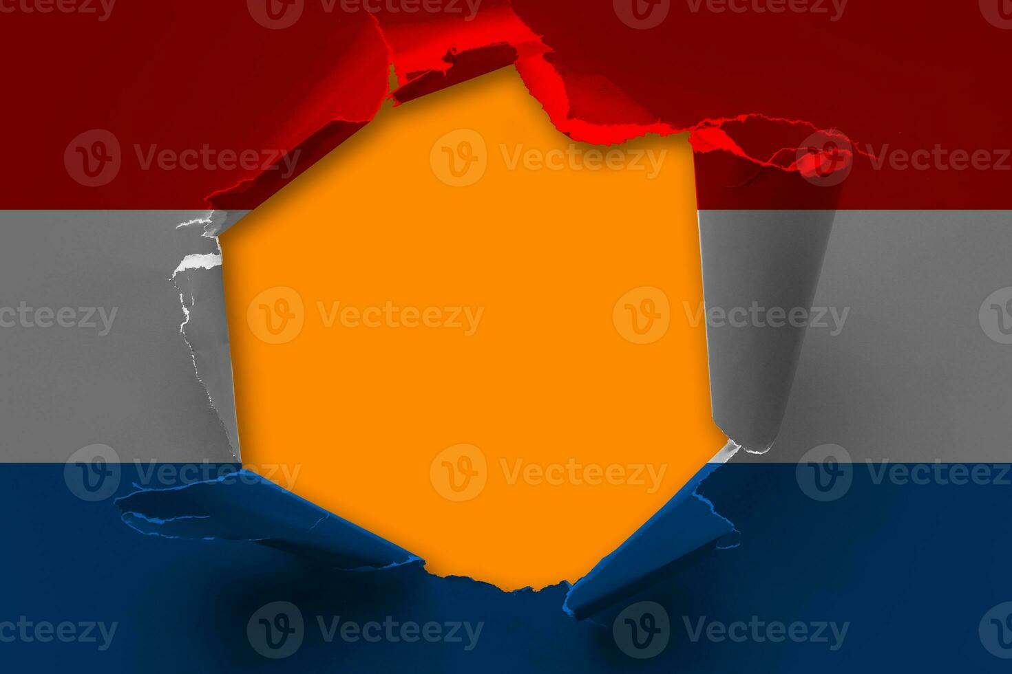 The concept of national flag on denim background with a hole Netherlands photo