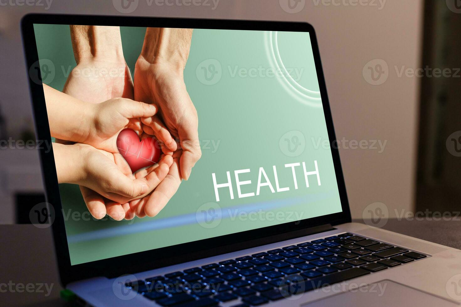 Doctor entering patient notes on a laptop in surgery photo