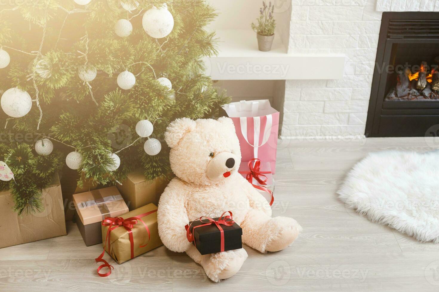 toy and gifts near christmas tree photo