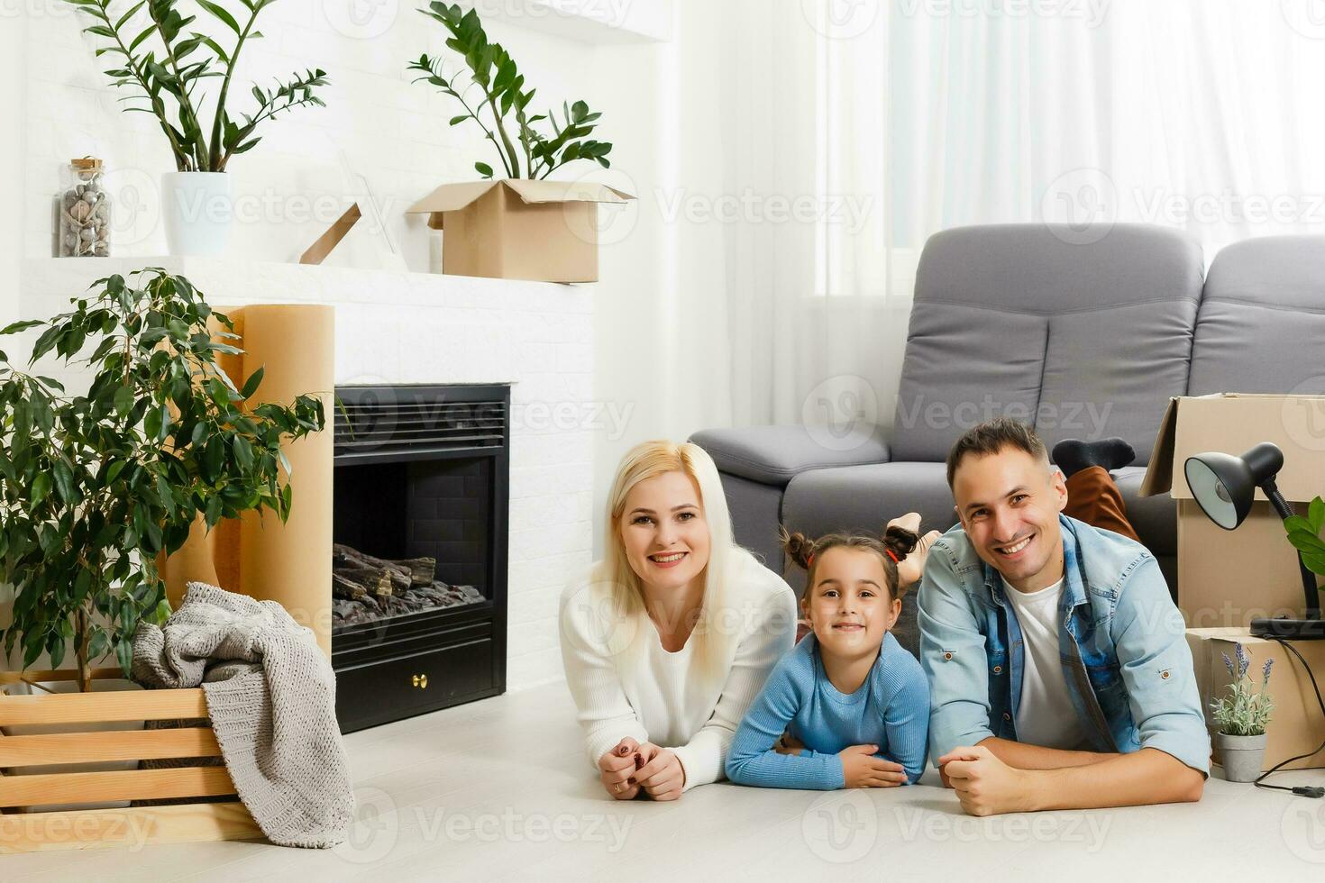 concept housing a young family. Mother father and child in new house with a roof at a home photo