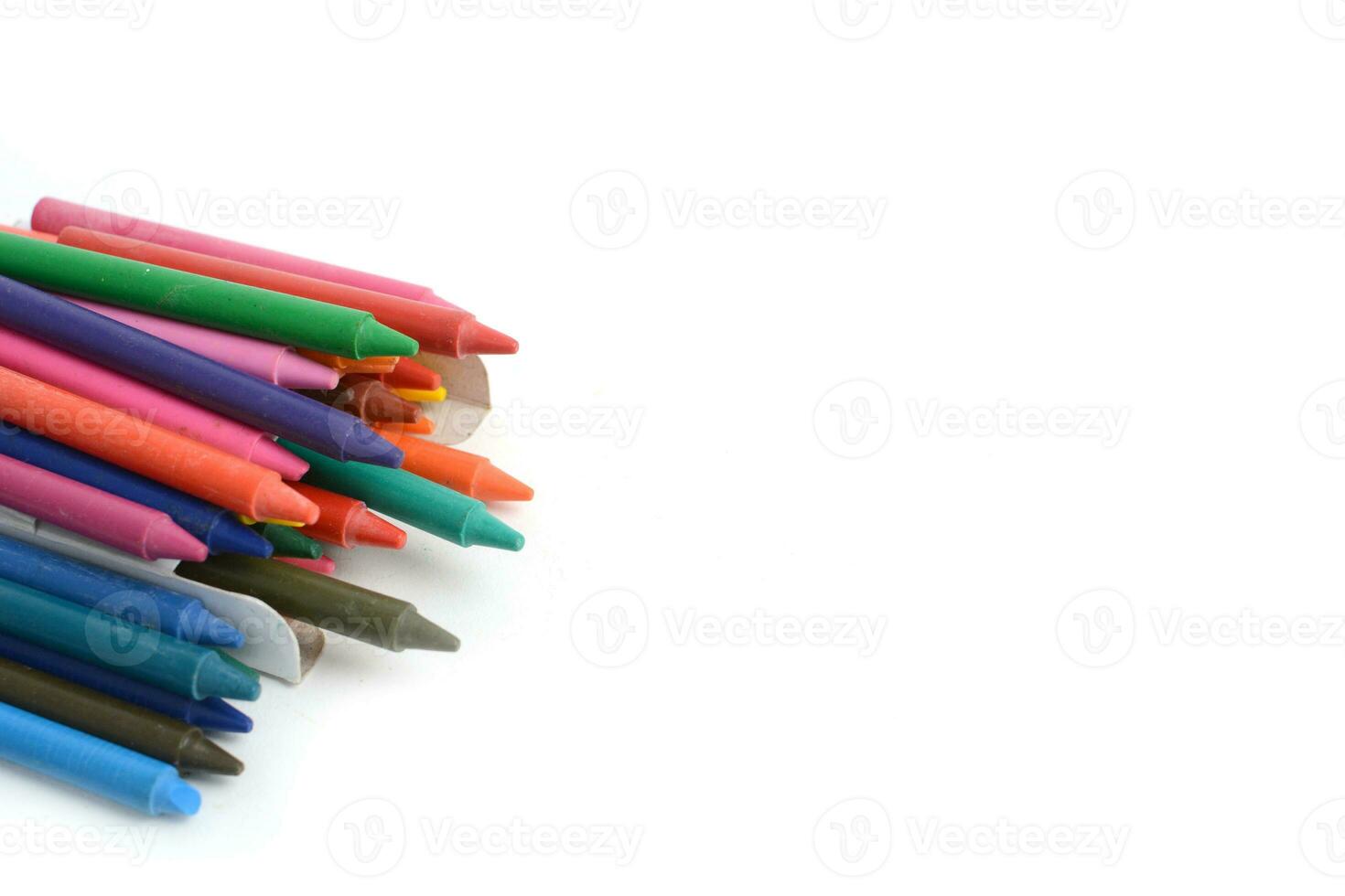 Crayons lined up isolated on white background. photo