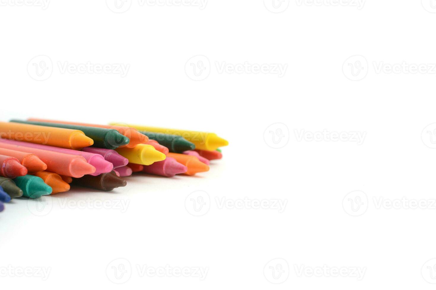Crayons lined up isolated on white background. photo