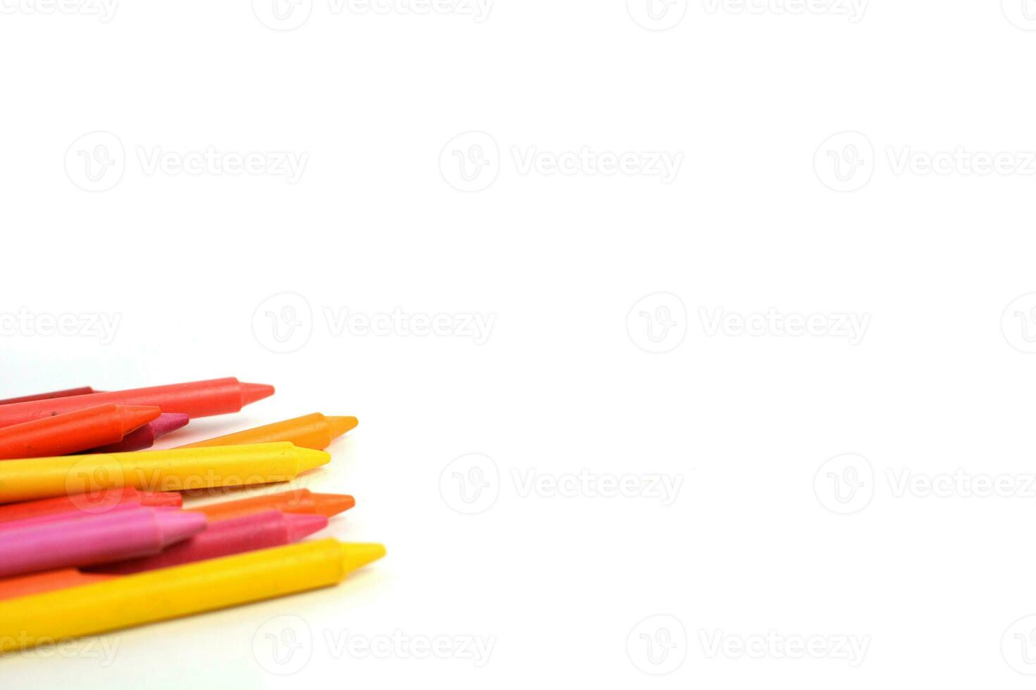 Crayons lined up isolated on white background. photo