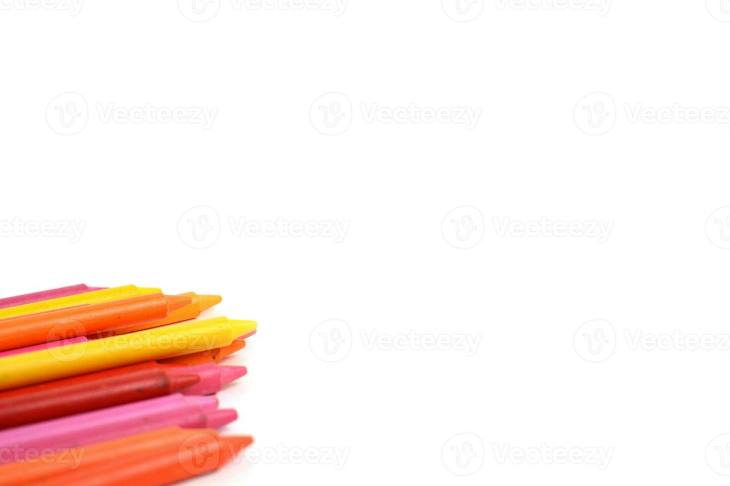 Crayons lined up isolated on white background. photo