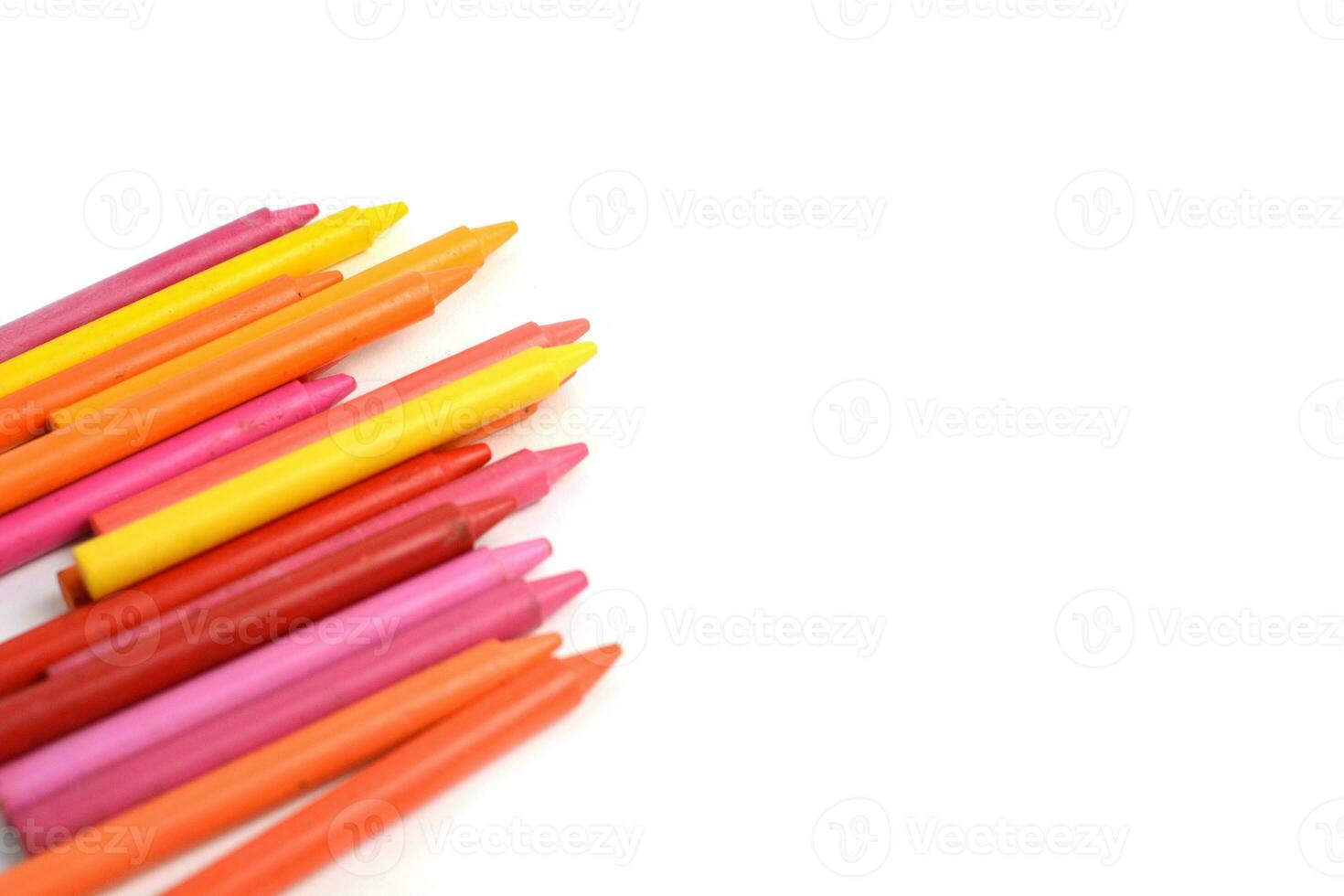 Crayons lined up isolated on white background. photo