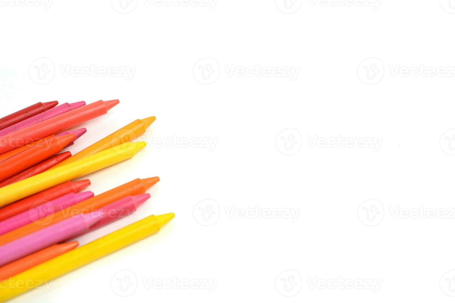 Crayons lined up isolated on white background. photo