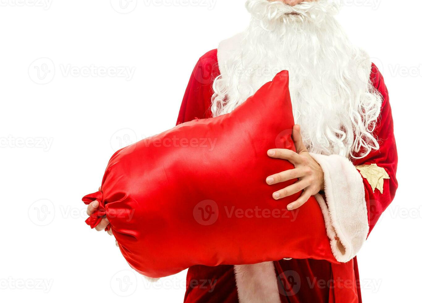 Santa claus holding a gifts against white background photo