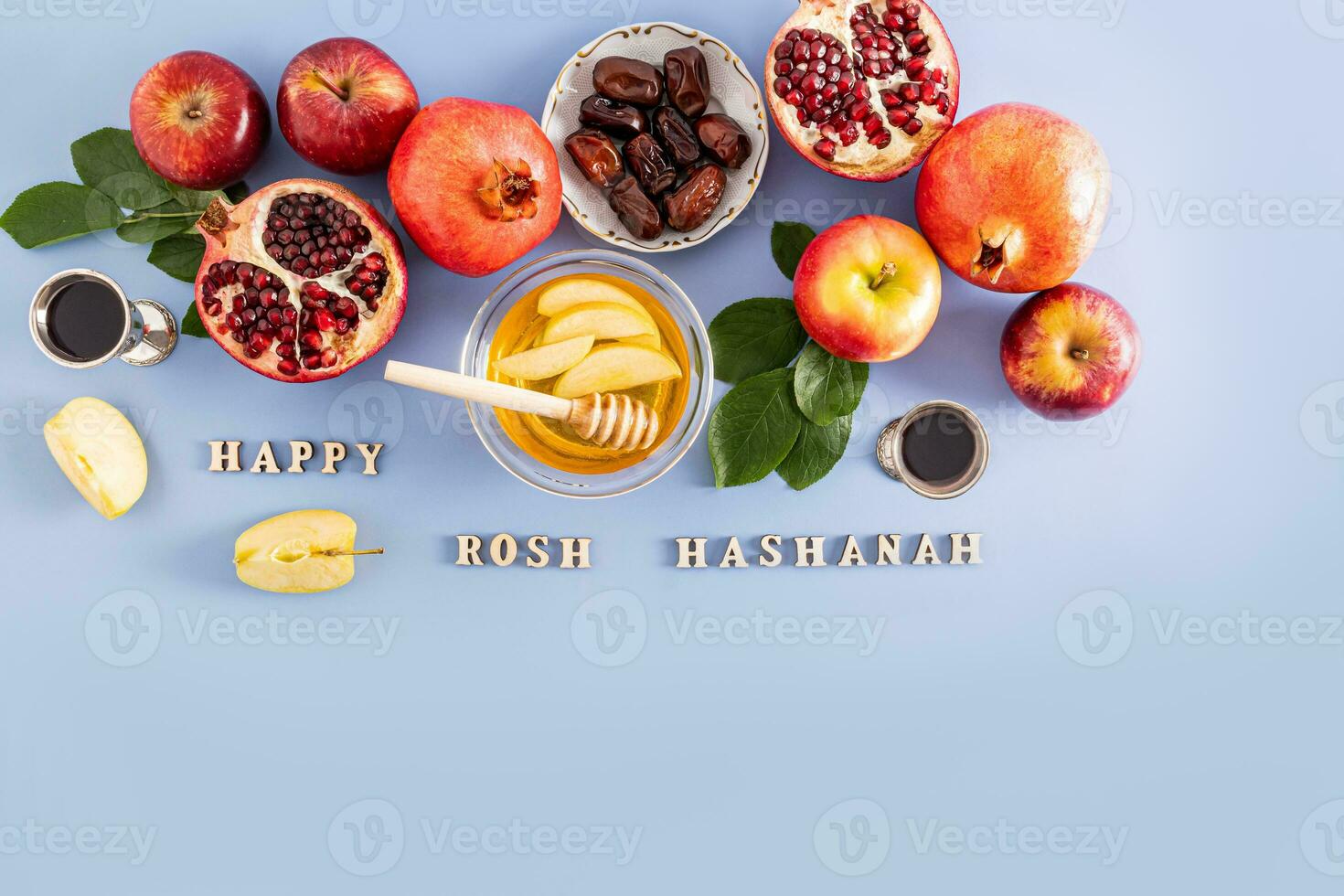 Beautiful festive background for the Jewish New Year. The concept of Rosh Hashanah. traditional products on a blue background with text. Top view. photo