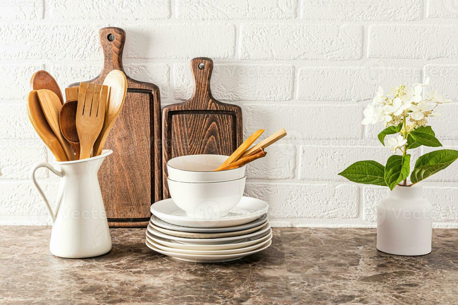Beautiful kitchen utensils made of natural materials on a modern wooden