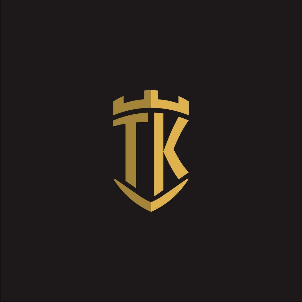 Initials TK logo monogram with shield style design vector