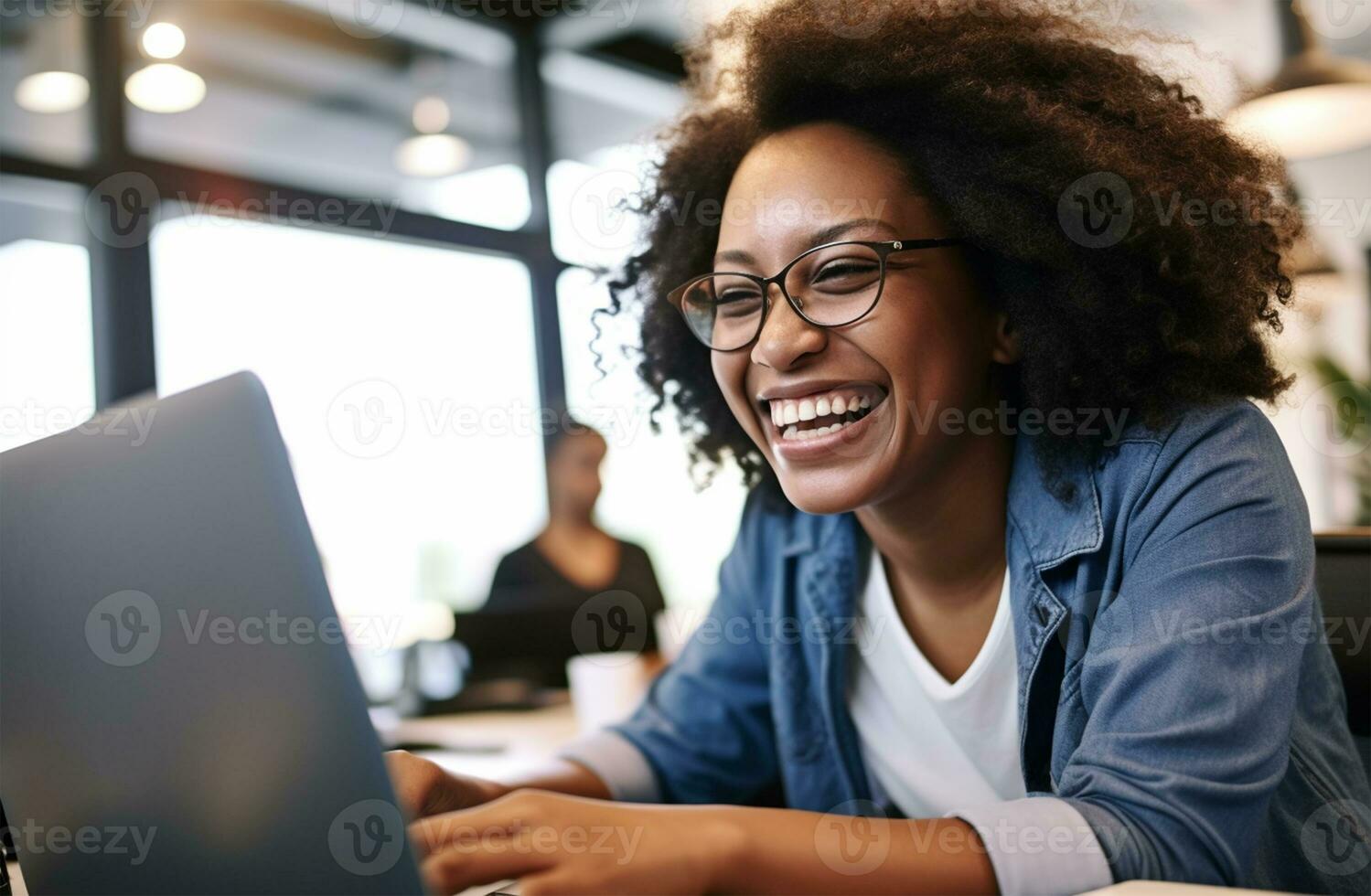 Candid portrait of a happy African American female woman working on a laptop computer in a bright office, hyper realist Ai Generated photo