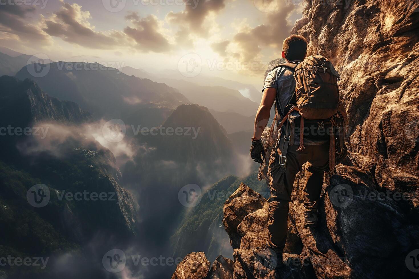 Back View of a Brave Man Climbing an Extreme Cliff in Bright Day photo