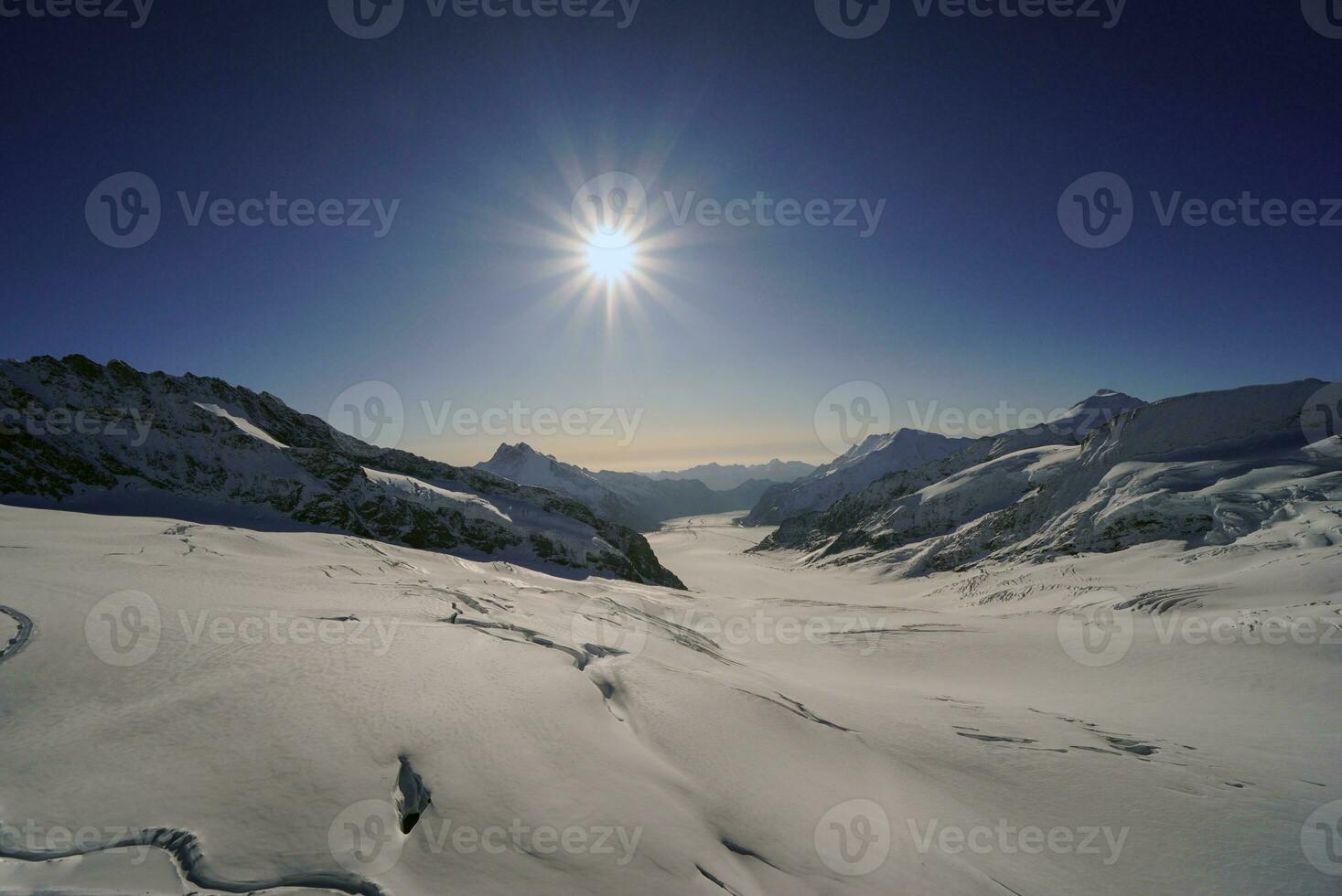 View of the nature trail, glaciers and sunlight shining in the beautiful morning Grindelwald First, Mount Eiger, the highest peak, Switzerland Alps For activities such as hiking, trekking, climbing. photo