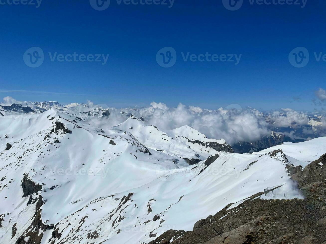 Switzerland, The beautiful snowy peaks of the Alps from Titlis mountain view. photo