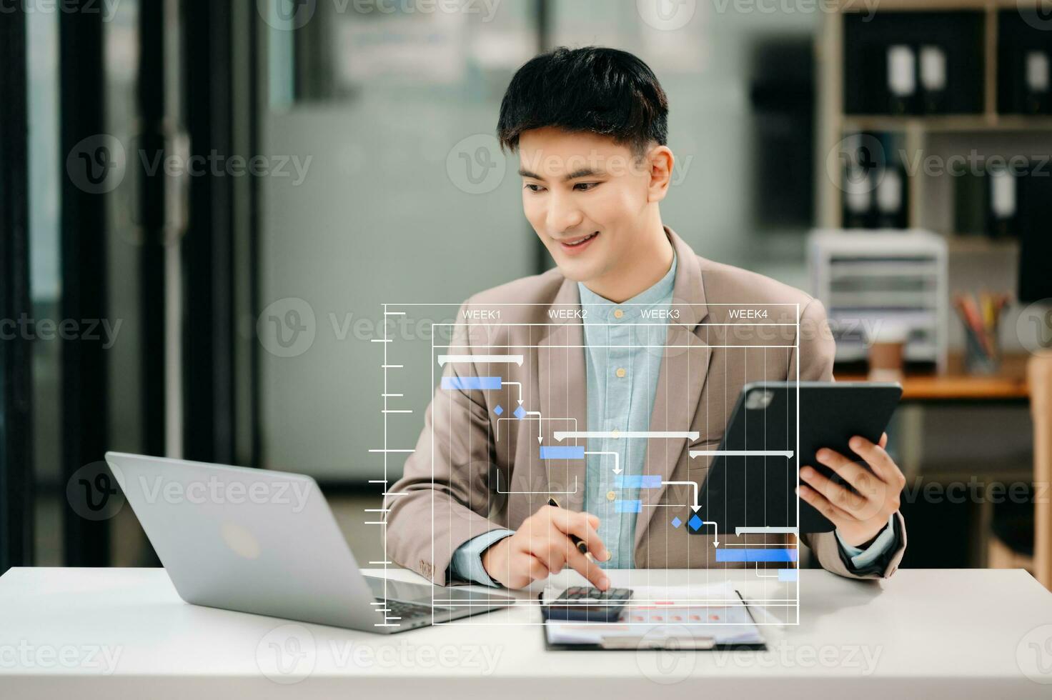 Project manager working and update tasks with milestones progress planning and Gantt chart scheduling diagram. business working with smart phone, tablet and laptop in office. photo