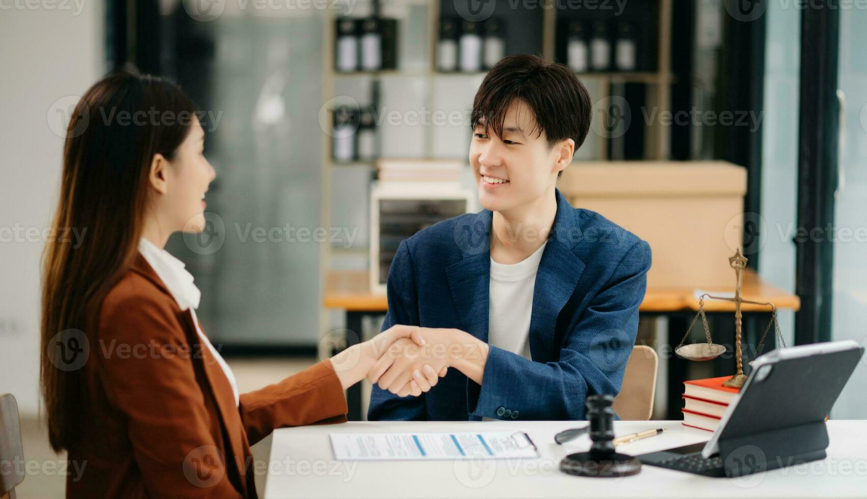 Consultation between a male lawyer and business customer, handshake after good deal agreement, Law and Legal concept.Good service cooperation photo