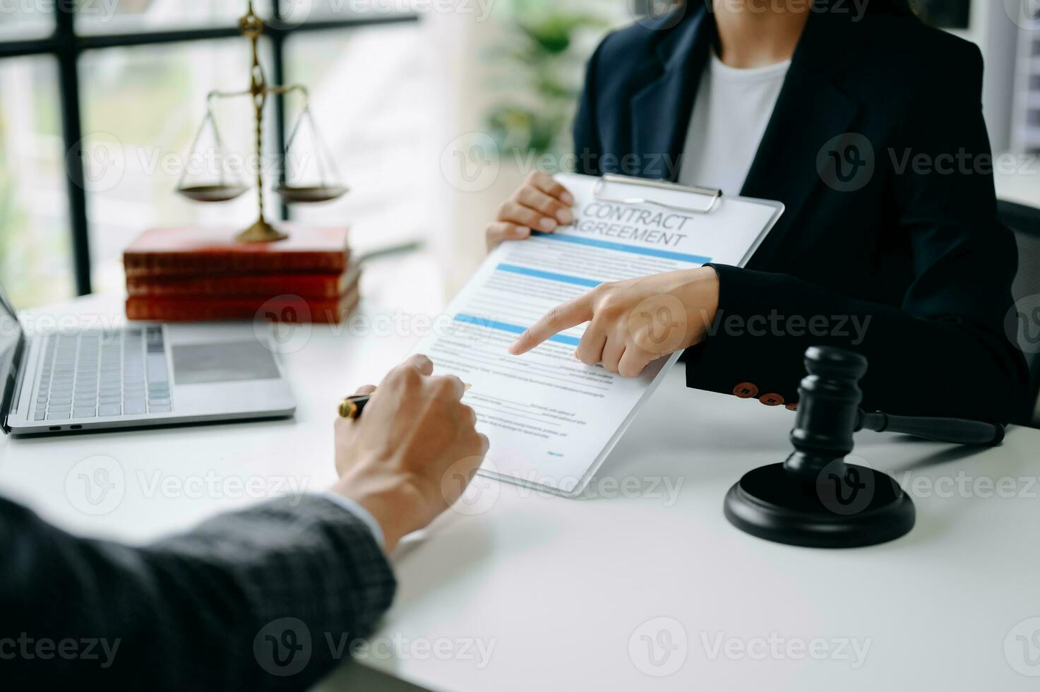 business people and lawyers discussing contract papers sitting at the table. Concepts of law, advice, legal services. photo