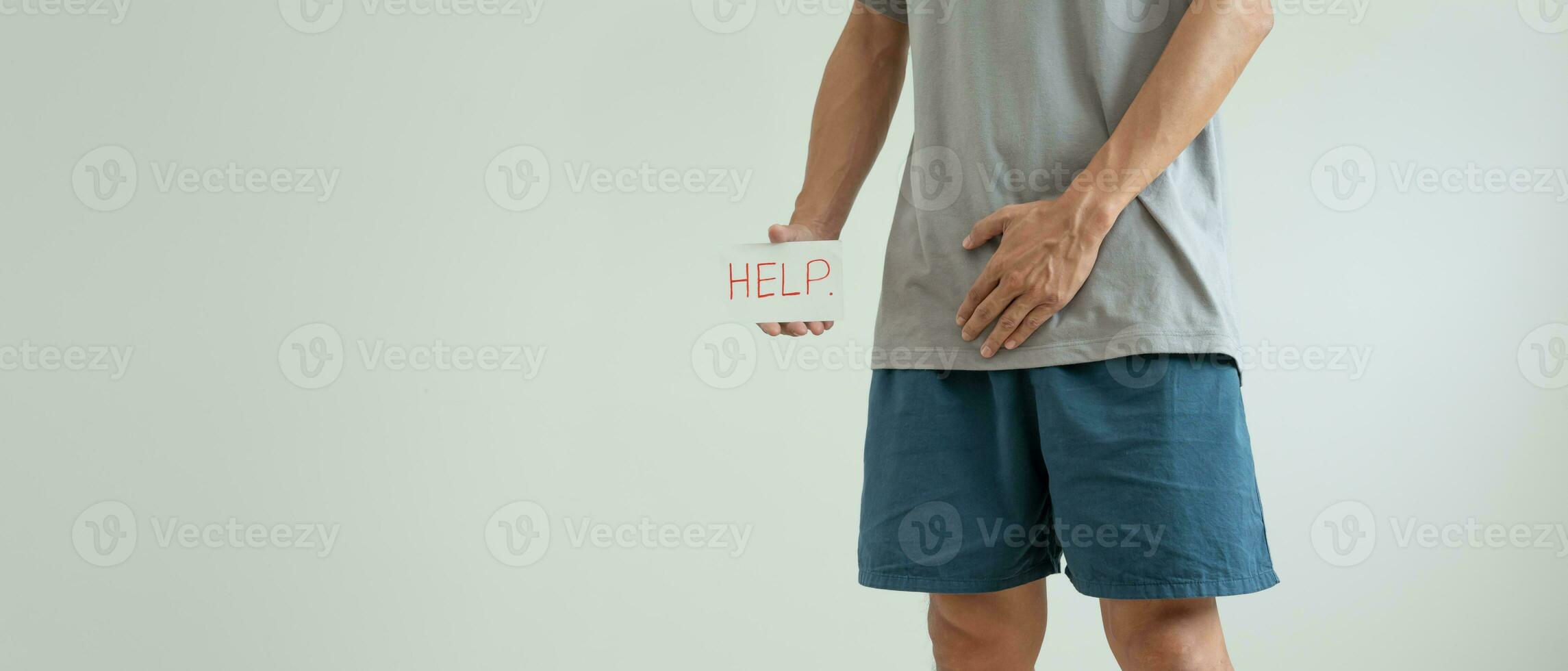 Man hold hand in front of private parts feeling discomfort from disease and inflammation. Venereal, testicular cancer. bladder problems, erectile dysfunction, premature ejaculation, prostate cancer photo