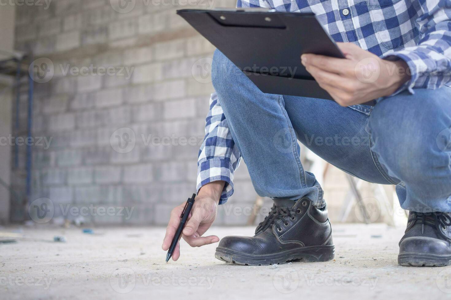 inspector or engineer is inspecting construction and quality assurance new house. Engineers or architects or contactor work to build the house before handing it over to the homeowner photo