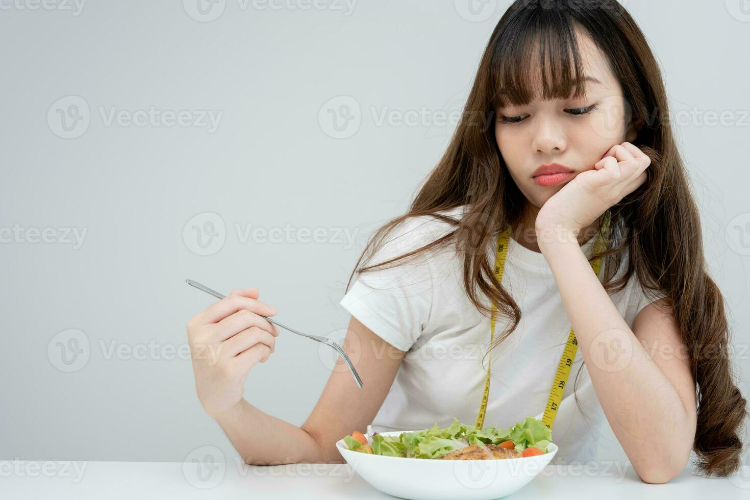 slim body asian women very bored diet food, dieting female choose low calories food for diet. Good healthy food. weight lose, balance, control, reduce fat, routines, exercise, body shape photo