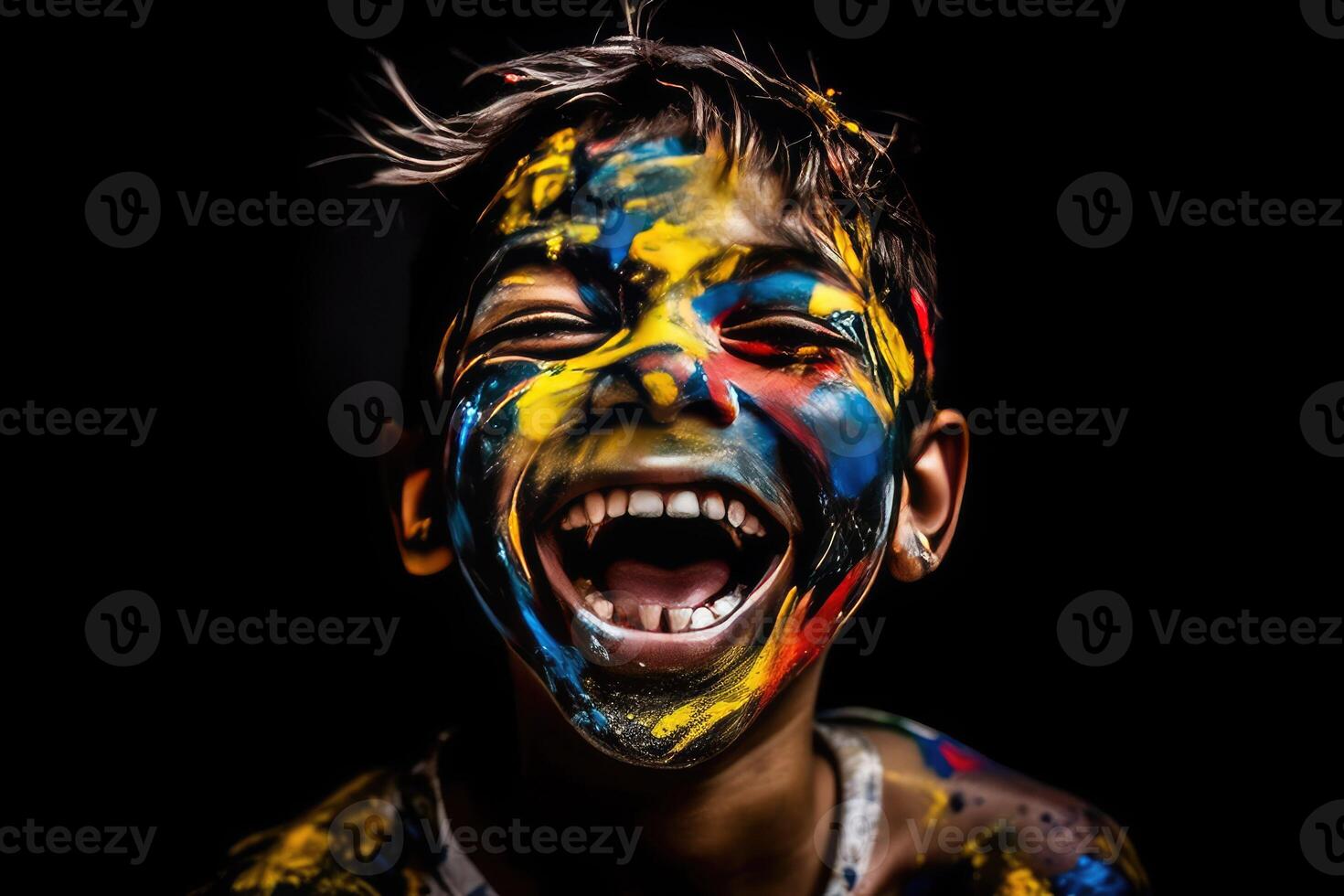 a boy with paint on his face laughing photo