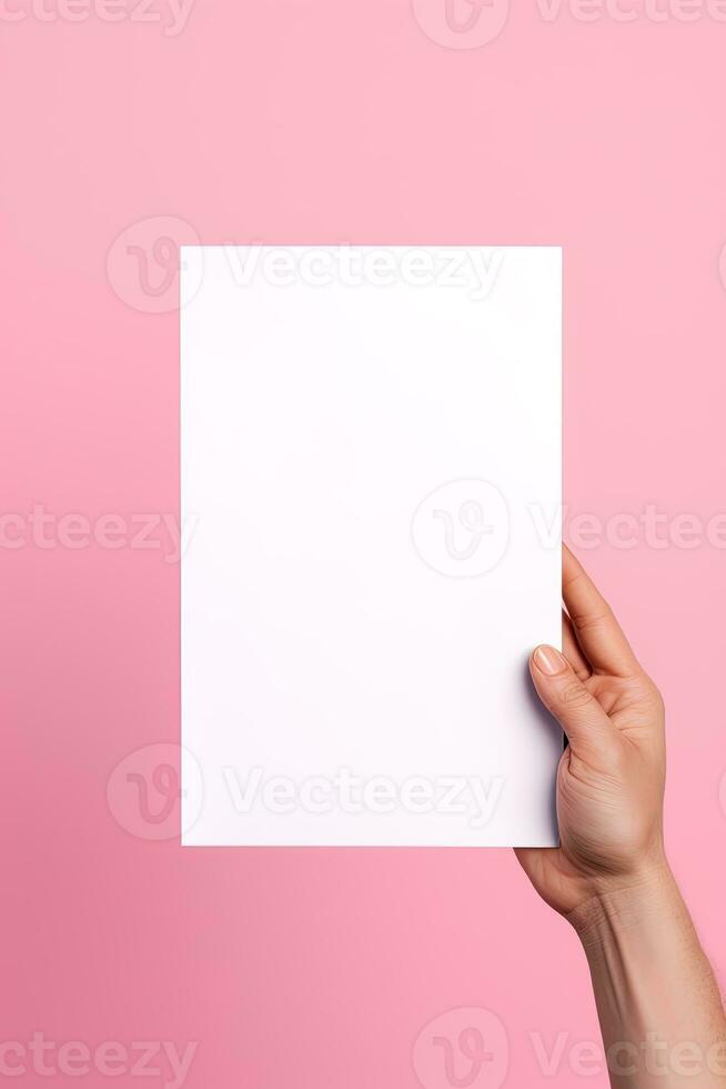 A human hand holding a blank sheet of white paper or card isolated on pink background. ai generated photo