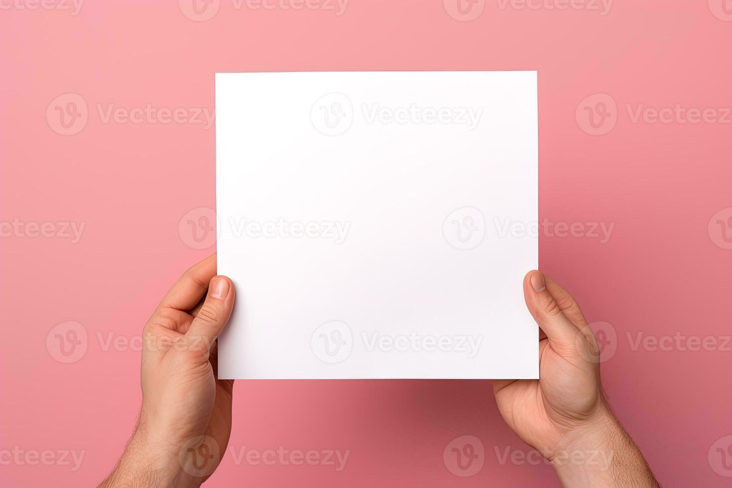 A human hand holding a blank sheet of white paper or card isolated on pink background. ai generated photo