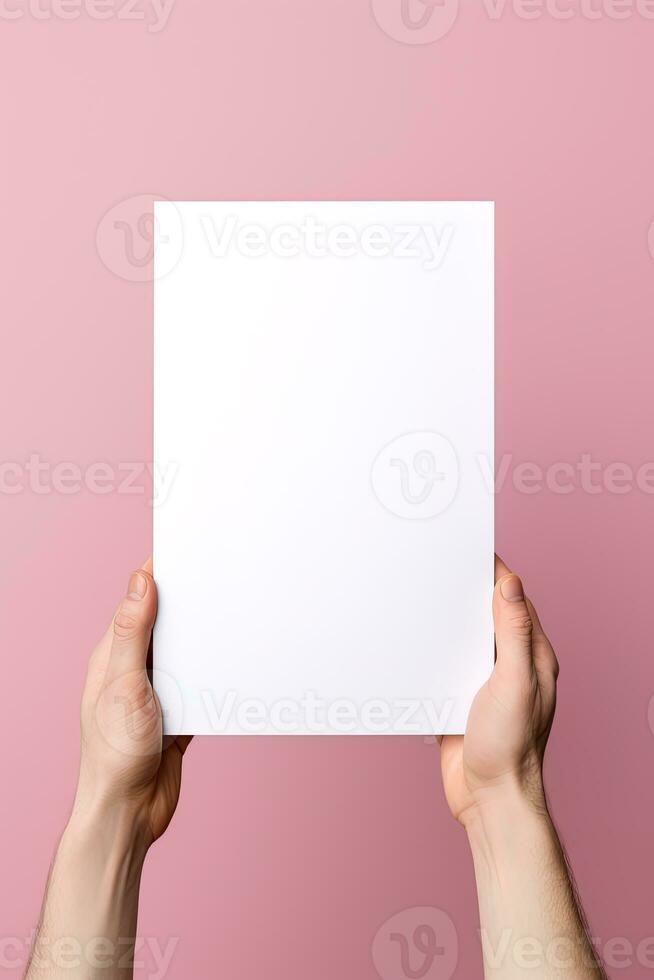 A human hand holding a blank sheet of white paper or card isolated on pink background. ai generated photo