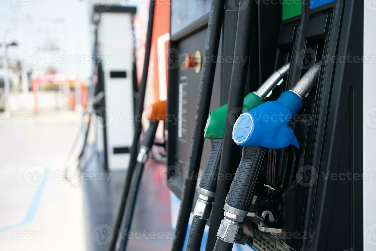 Gas pump nozzle in petrol station. Fuel dispenser machine. photo