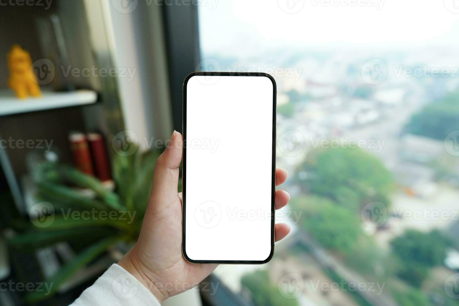 Close up of women's hands holding cell telephone blank copy space screen. smart phone with technology concept photo