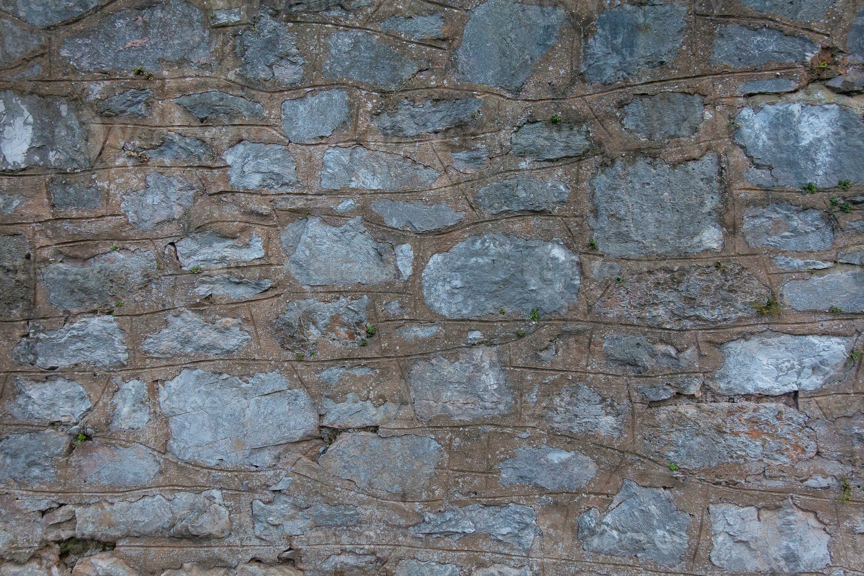 Stone walls are made of huge large bricks with concrete and cement