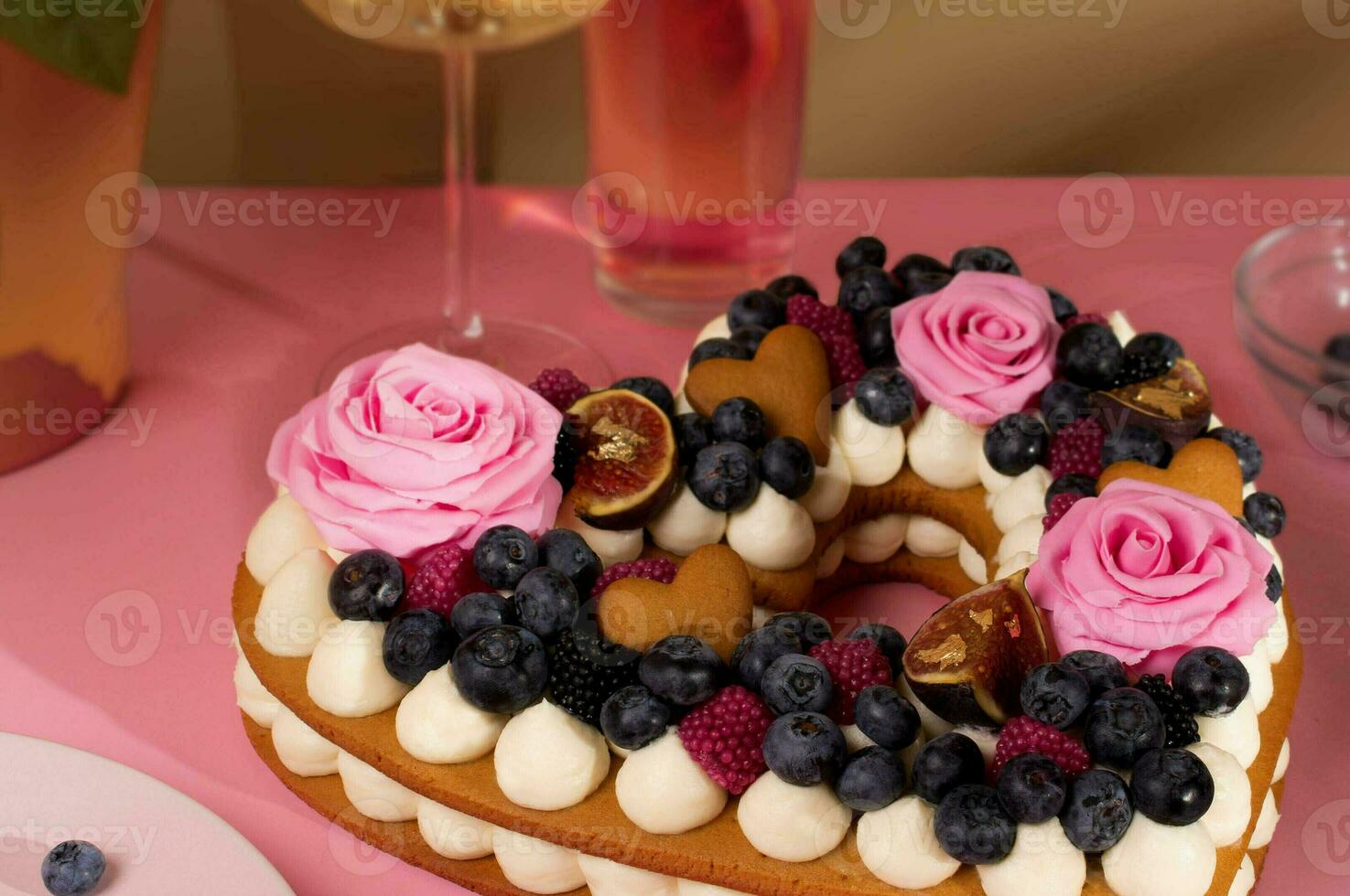 Valentines cake, honey cake, heart cake, birthday pink with wine and roses close up photo
