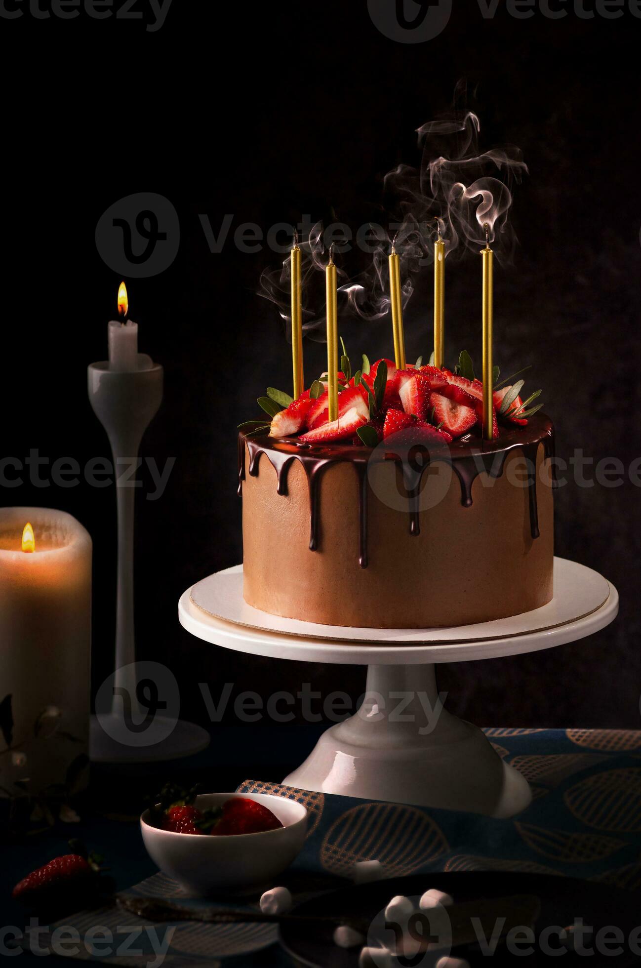 Birthday chocolate cake with candles. Blow out candles on top of a cake