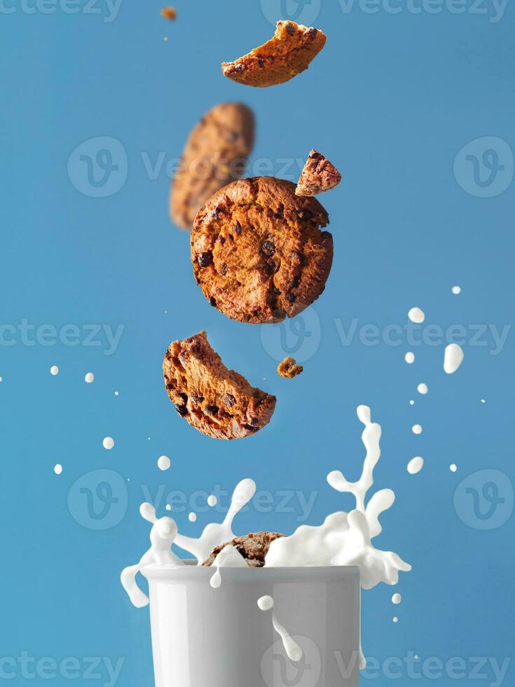 Glass of milk and splash. With cookies levitation. Milk and cookie. Food photo