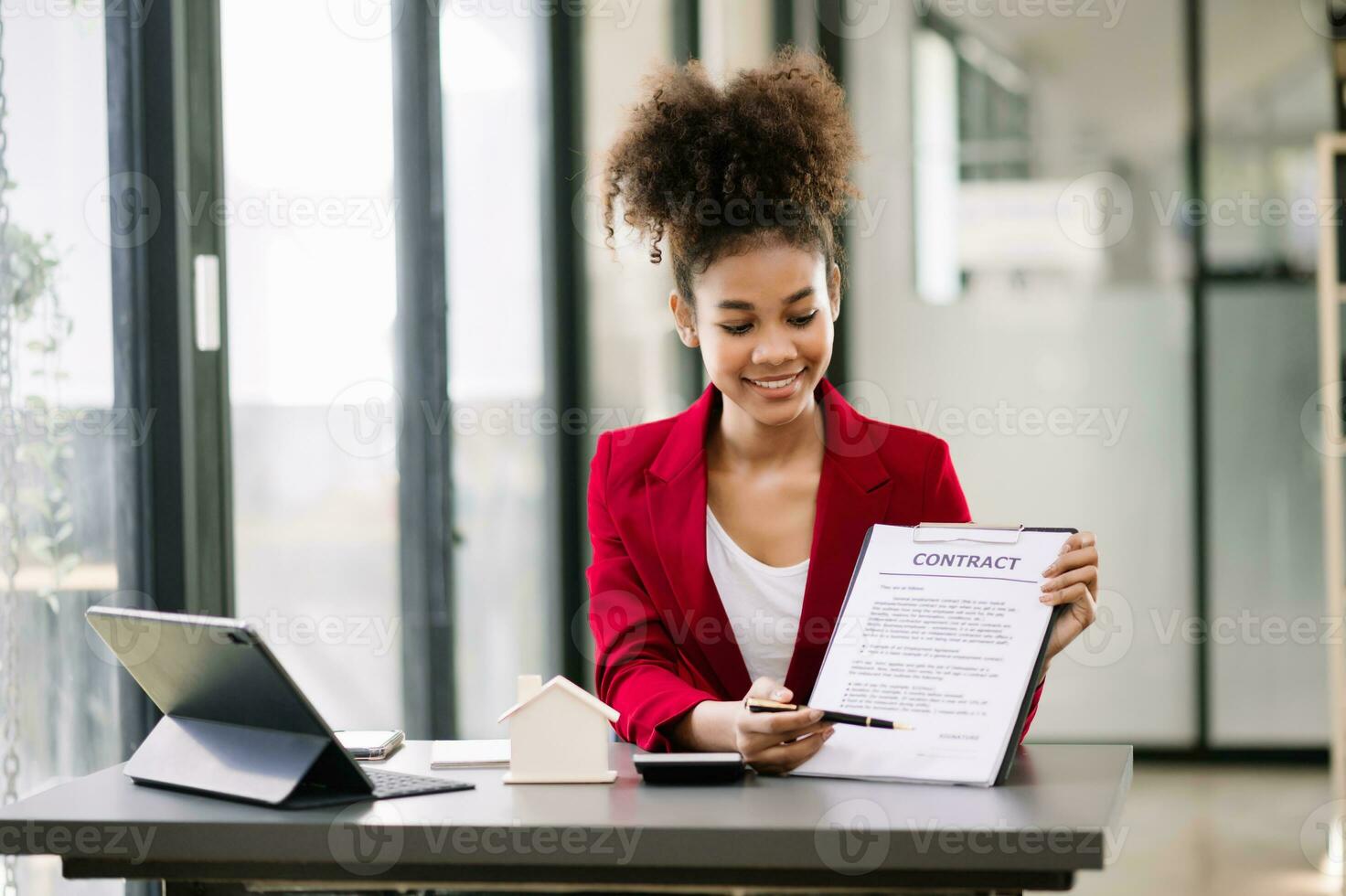 Signed the house buy a contract with the house sales agents. Buy or sell home concept. Happy in marketing signing contract of house photo