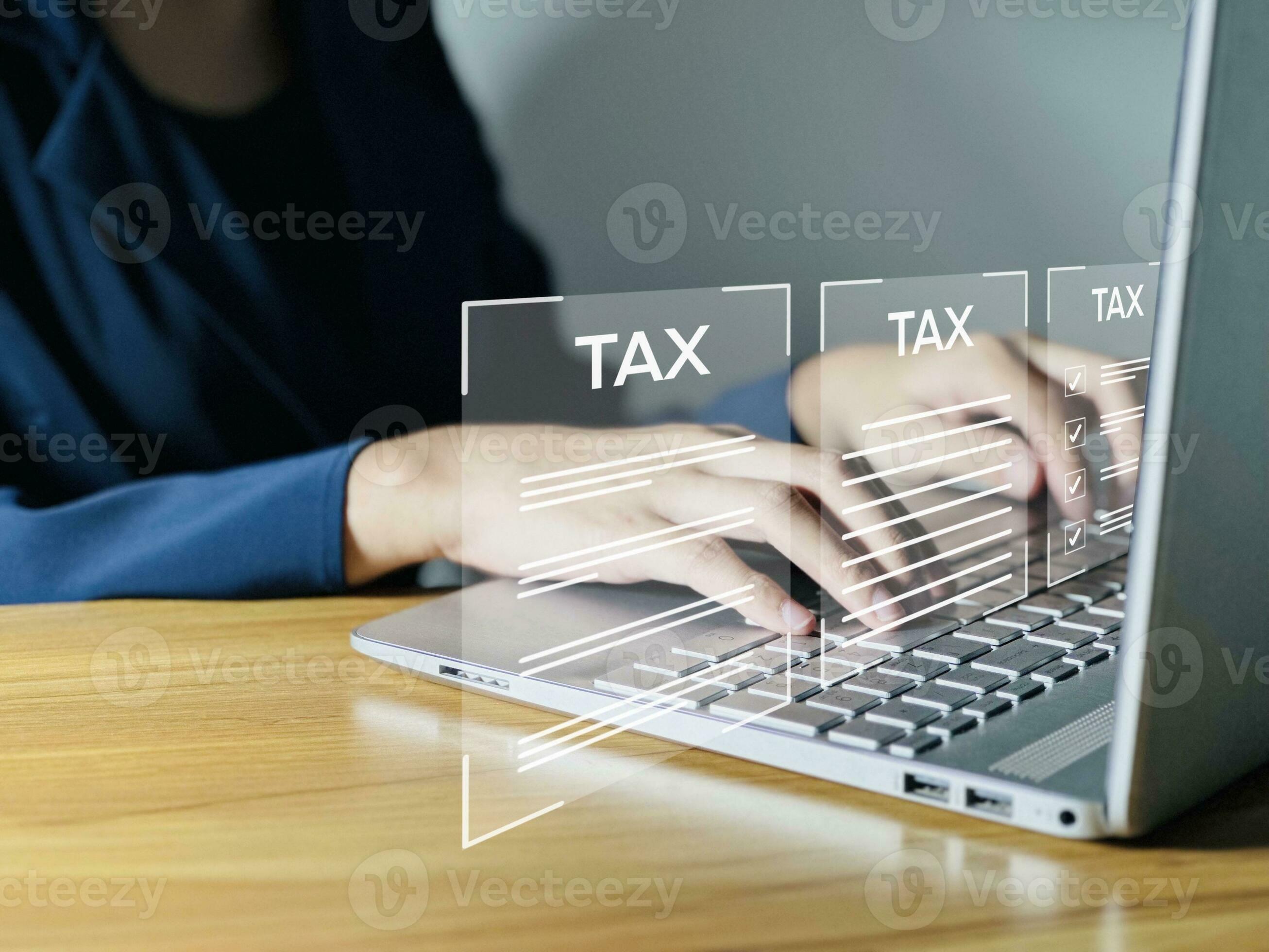 Business people use computers to fill out annual tax information