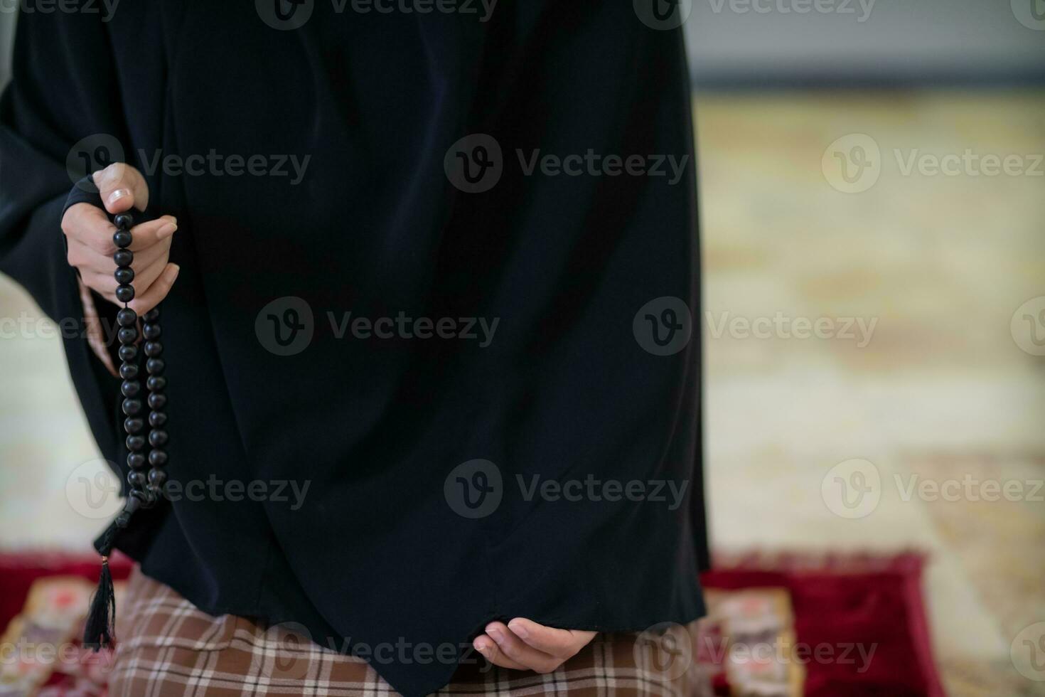 muslim women in hijab are praying to show respect and thanks to allah according to muslim belief and muslim women in hijab are praying to allah according to traditional belief from quran photo
