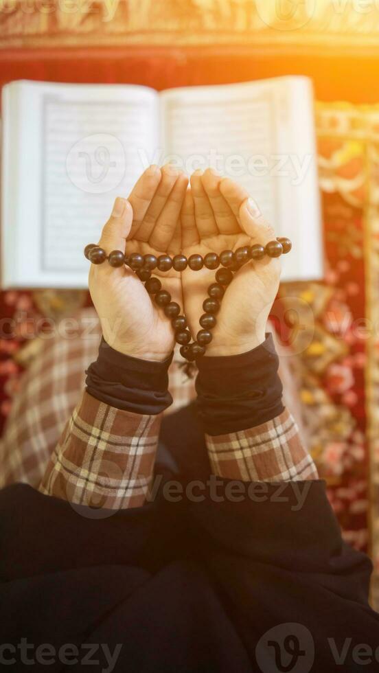 muslim women in hijab are praying to show respect and thanks to allah according to muslim belief and muslim women in hijab are praying to allah according to traditional belief from quran photo