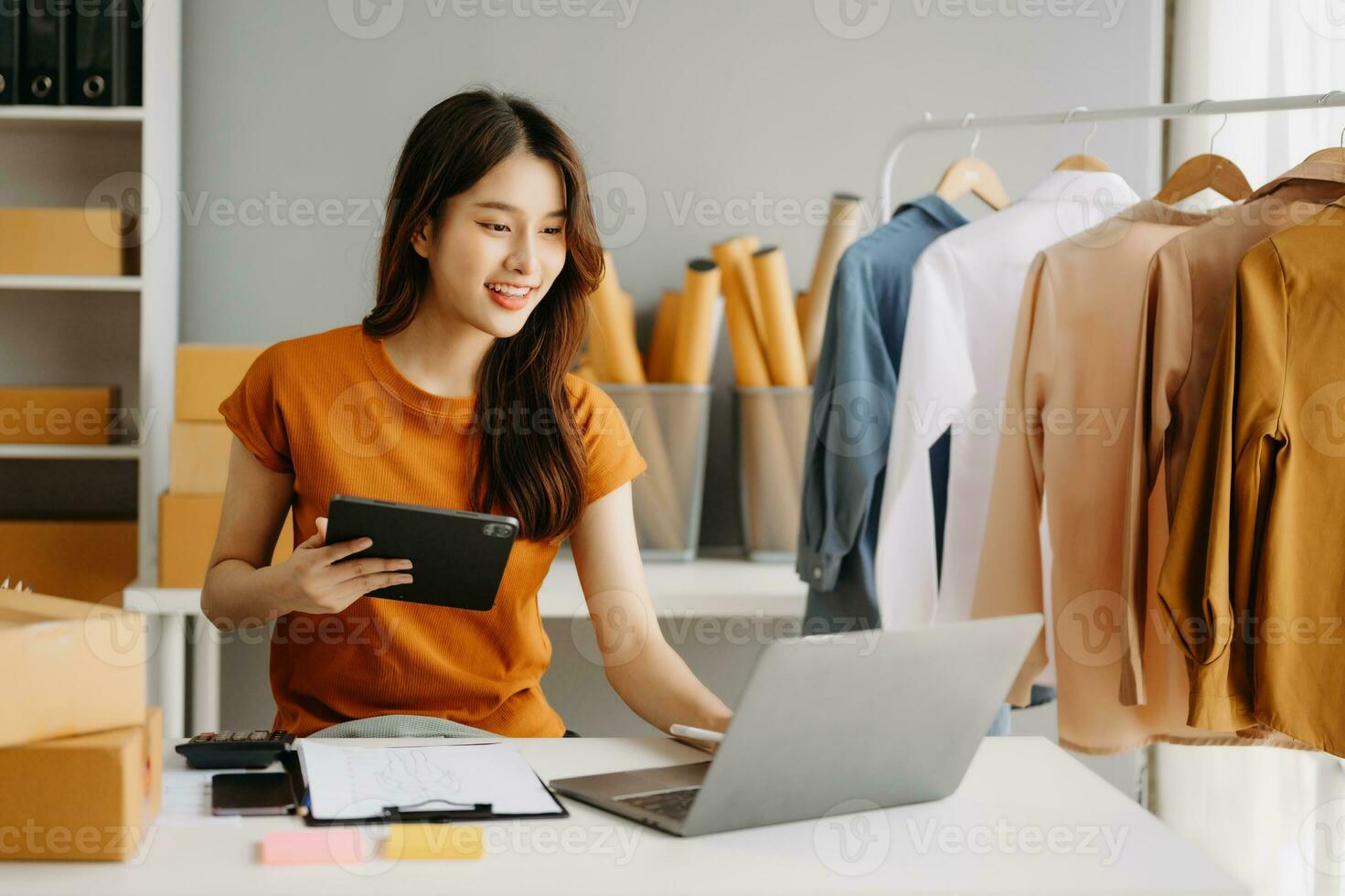 Fashion blogger concept, Young Asian women selling clothes on video  streaming.Startup small business SME, using smartphone or tablet taking  receive and checking 27722194 Stock Photo at Vecteezy